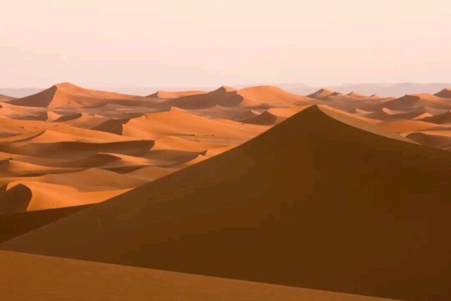 Golden Erg Chebbi dunes and camel trekking in Merzouga Sahara Desert