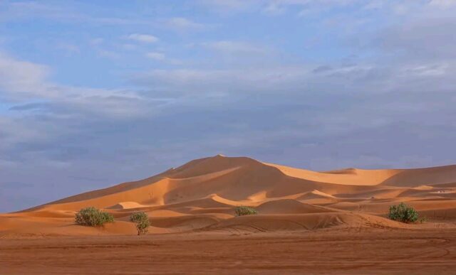 Golden sand dunes of Erg Chebbi in the Sahara Desert during a 3 days Fes to Marrakech desert tour